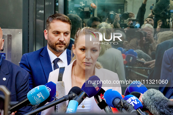 French far-right Reconquete party lead candidate Marion Marechal speaks to media representatives outside the Rassemblement National (RN) par...