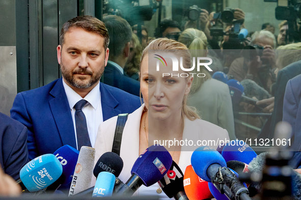 French far-right Reconquete party lead candidate Marion Marechal speaks to media representatives outside the Rassemblement National (RN) par...