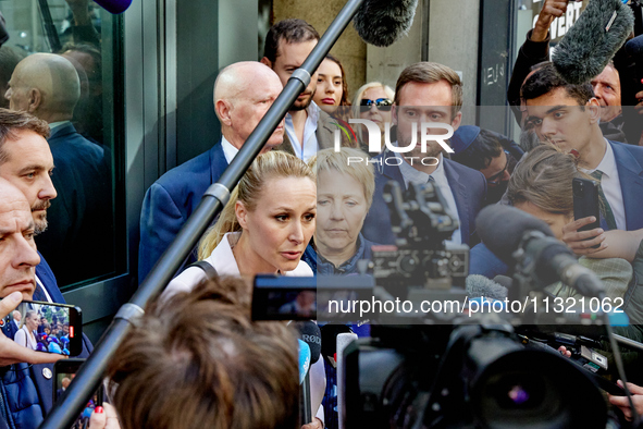 French far-right Reconquete party lead candidate Marion Marechal speaks to media representatives outside the Rassemblement National (RN) par...