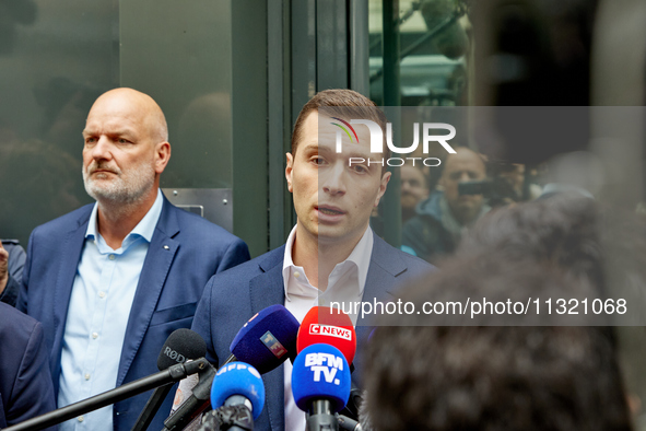 French far-right Rassemblement National (RN) party president and lead MEP, Jordan Bardella, speaks to media representatives outside the Rass...