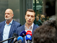 French far-right Rassemblement National (RN) party president and lead MEP, Jordan Bardella, speaks to media representatives outside the Rass...