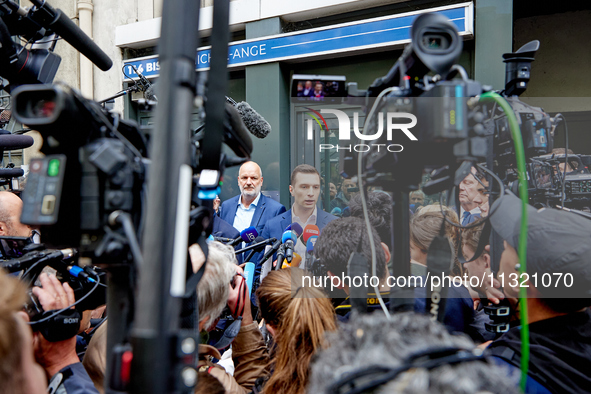 French far-right Rassemblement National (RN) party president and lead MEP, Jordan Bardella, speaks to media representatives outside the Rass...