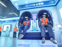 Workers are simulating a production safety accident at a VR safety experience hall in Huzhou, Zhejiang province, China, on June 11, 2024. (