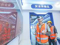 Workers are simulating a production safety accident at a VR safety experience hall in Huzhou, Zhejiang province, China, on June 11, 2024. (