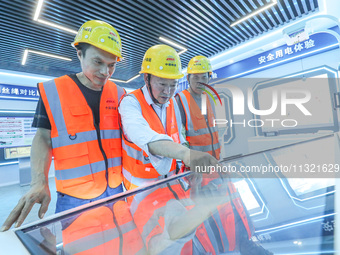 Workers are conducting safety inspections at a VR safety experience hall in Huzhou, China, on June 11, 2024. (