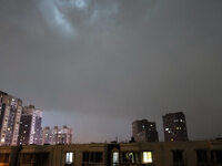 Strong winds, torrential rain, thunder, and lightning are occurring at dusk in Beijing, China, on June 11, 2024. (