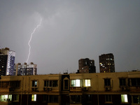 Strong winds, torrential rain, thunder, and lightning are occurring at dusk in Beijing, China, on June 11, 2024. (