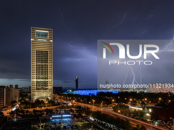 Thunderstorms and strong winds are occurring over the National Stadium in Beijing, China, on June 11, 2024. (