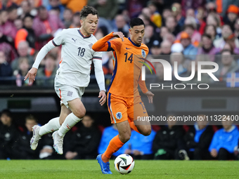 Mikael Anderson Left Winger of Iceland and Aarhus GF and Tijjani Reijnders Central Midfield of Netherland and AC Milan compete for the ball...