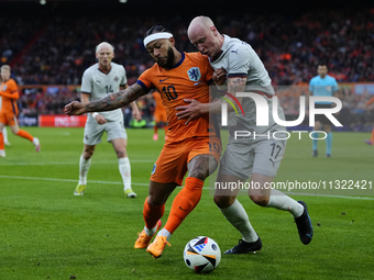 Memphis Depay Centre-Forward of Netherland and Atletico de Madrid and Valgeir Lunddal Fridriksson Right-Back of Iceland and BK Hacken during...