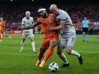 Memphis Depay Centre-Forward of Netherland and Atletico de Madrid and Valgeir Lunddal Fridriksson Right-Back of Iceland and BK Hacken during...