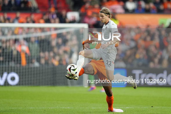 Andri Gudjohnsen Centre-Forward of Iceland and Lyngby BK and Virgil van Dijk Centre-Back of Netherland and Liverpool FC compete for the ball...