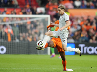 Andri Gudjohnsen Centre-Forward of Iceland and Lyngby BK and Virgil van Dijk Centre-Back of Netherland and Liverpool FC compete for the ball...