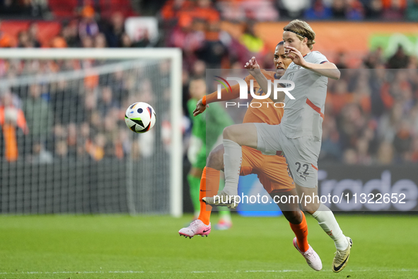 Andri Gudjohnsen Centre-Forward of Iceland and Lyngby BK and Virgil van Dijk Centre-Back of Netherland and Liverpool FC compete for the ball...