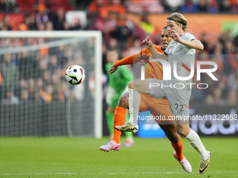 Andri Gudjohnsen Centre-Forward of Iceland and Lyngby BK and Virgil van Dijk Centre-Back of Netherland and Liverpool FC compete for the ball...