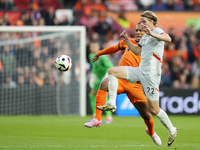 Andri Gudjohnsen Centre-Forward of Iceland and Lyngby BK and Virgil van Dijk Centre-Back of Netherland and Liverpool FC compete for the ball...