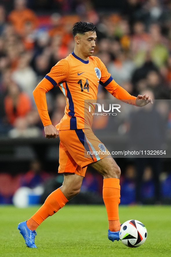 Tijjani Reijnders Central Midfield of Netherland and AC Milan controls the ball during the international friendly match between Netherlands...