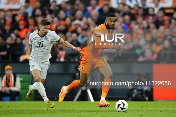 Bjarki Bjarkason Left Winger of Iceland and Venezia FC  and Cody Gakpo Left Winger of Netherland and Liverpool FC compete for the ball durin...