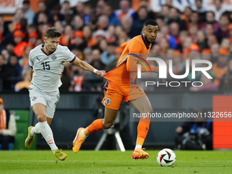 Bjarki Bjarkason Left Winger of Iceland and Venezia FC  and Cody Gakpo Left Winger of Netherland and Liverpool FC compete for the ball durin...