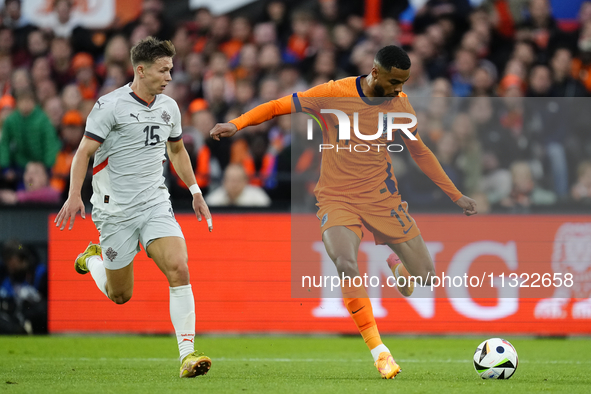 Bjarki Bjarkason Left Winger of Iceland and Venezia FC  and Cody Gakpo Left Winger of Netherland and Liverpool FC compete for the ball durin...