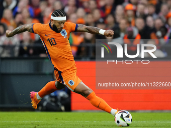 Memphis Depay Centre-Forward of Netherland and Atletico de Madrid controls the ball during the international friendly match between Netherla...