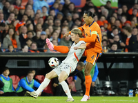 Andri Gudjohnsen Centre-Forward of Iceland and Lyngby BK and Virgil van Dijk Centre-Back of Netherland and Liverpool FC compete for the ball...