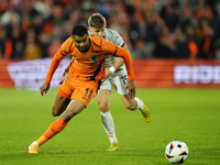 Cody Gakpo Left Winger of Netherland and Liverpool FC and Bjarki Bjarkason Left Winger of Iceland and Venezia FC compete for the ball during...