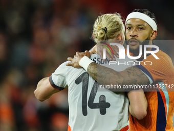 Memphis Depay Centre-Forward of Netherland and Atletico de Madrid and Kolbeinn Finnsson Left-Back Lyngby BK talks during the international f...