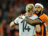 Memphis Depay Centre-Forward of Netherland and Atletico de Madrid and Kolbeinn Finnsson Left-Back Lyngby BK talks during the international f...