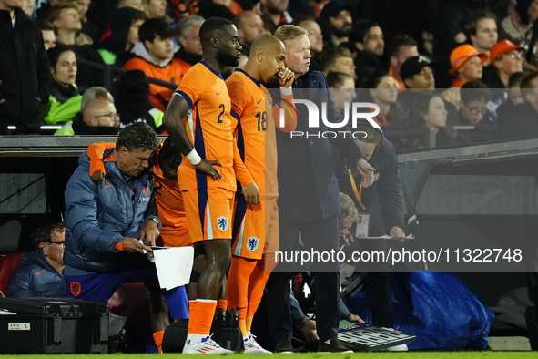 Ronald Koeman head coach of Netherland gives instructions  to Donyell Malen Right Winger of Netherland and Borussia Dortmund during the inte...