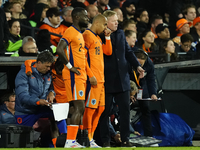 Ronald Koeman head coach of Netherland gives instructions  to Donyell Malen Right Winger of Netherland and Borussia Dortmund during the inte...