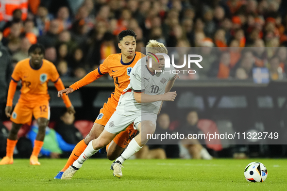 Hakon Arnar Haraldsson Left Winger of Iceland and LOSC Lille and  Tijjani Reijnders Central Midfield of Netherland and AC Milan compete for...