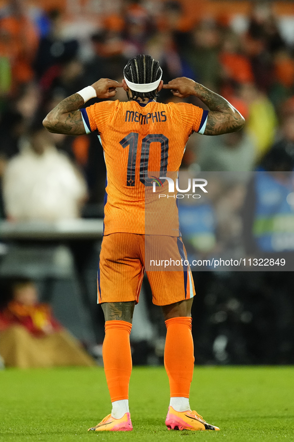 Memphis Depay Centre-Forward of Netherland and Atletico de Madrid celebrates after scoring his sides first goal during the international fri...