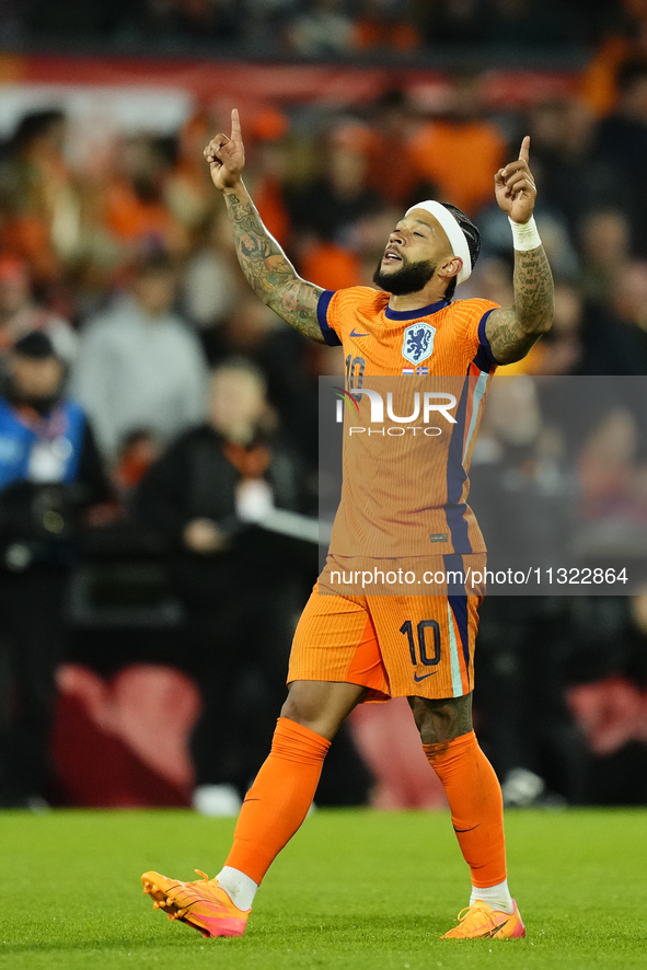 Memphis Depay Centre-Forward of Netherland and Atletico de Madrid celebrates after scoring his sides first goal during the international fri...