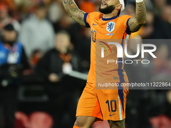 Memphis Depay Centre-Forward of Netherland and Atletico de Madrid celebrates after scoring his sides first goal during the international fri...