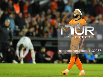 Memphis Depay Centre-Forward of Netherland and Atletico de Madrid celebrates after scoring his sides first goal during the international fri...