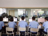 Staff members of the quality inspection team are checking the scanning quality at the scanning point of the Jiangsu Provincial College Entra...