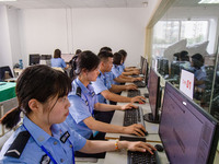 Staff members of the quality inspection team are checking the scanning quality at the scanning point of the Jiangsu Provincial College Entra...