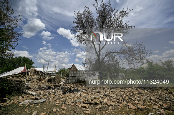 The rubble is covering the ground near a house that is partially destroyed by a Russian drone attack in Orikhiv, Zaporizhzhia region, southe...