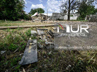 Debris is covering the ground at a house that is partially destroyed by a Russian drone attack in Orikhiv, Zaporizhzhia region, southeastern...