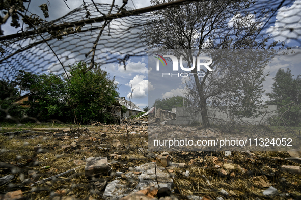 The rubble is covering the ground near a house that is partially destroyed by a Russian drone attack in Orikhiv, Zaporizhzhia region, southe...