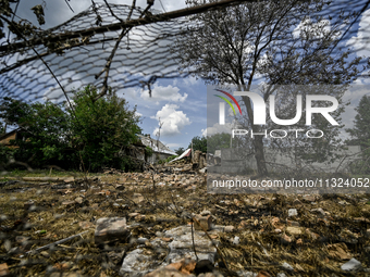 The rubble is covering the ground near a house that is partially destroyed by a Russian drone attack in Orikhiv, Zaporizhzhia region, southe...