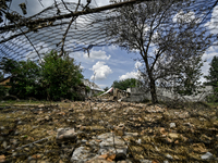 The rubble is covering the ground near a house that is partially destroyed by a Russian drone attack in Orikhiv, Zaporizhzhia region, southe...