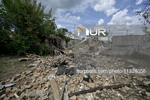 The rubble is covering the ground near a house that is partially destroyed by a Russian drone attack in Orikhiv, Zaporizhzhia region, southe...