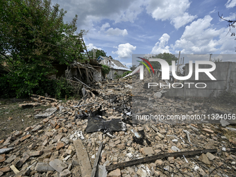 The rubble is covering the ground near a house that is partially destroyed by a Russian drone attack in Orikhiv, Zaporizhzhia region, southe...