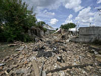 The rubble is covering the ground near a house that is partially destroyed by a Russian drone attack in Orikhiv, Zaporizhzhia region, southe...