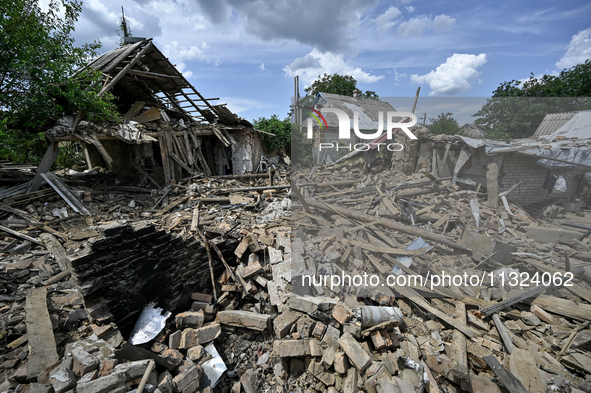 The rubble is covering the ground near a house that is partially destroyed by a Russian drone attack in Orikhiv, Zaporizhzhia region, southe...