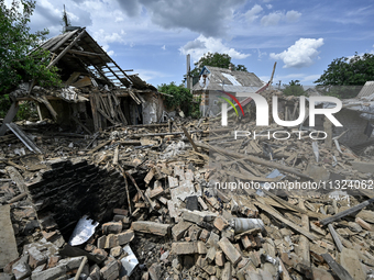 The rubble is covering the ground near a house that is partially destroyed by a Russian drone attack in Orikhiv, Zaporizhzhia region, southe...