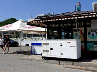 A generator is being installed outside a coffee shop at the seaside in Odesa, Ukraine, on June 11, 2024. NO USE RUSSIA. NO USE BELARUS. (