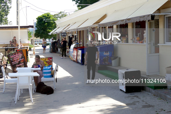 A generator is powering a cafe at the seaside during rolling blackouts in Odesa, Ukraine, on June 11, 2024. NO USE RUSSIA. NO USE BELARUS. 